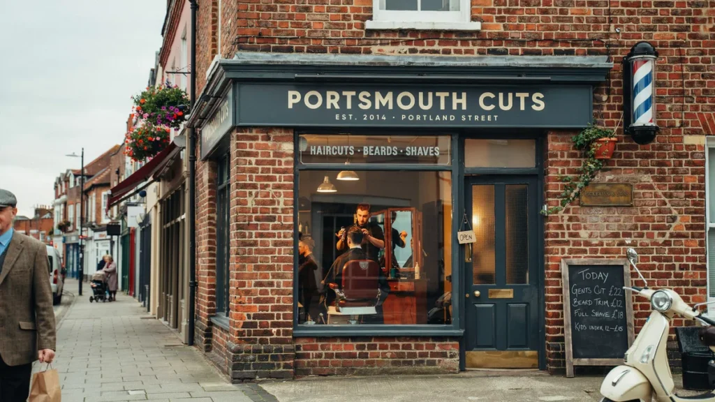 Welcoming Portsmouth barbershop exterior with clean signage and professional local presence