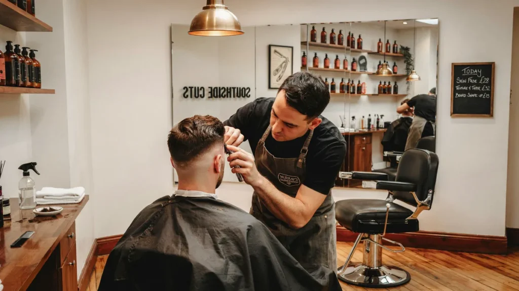 Clean skin fade haircut with sharp blend and textured top in a modern Southsea barbershop