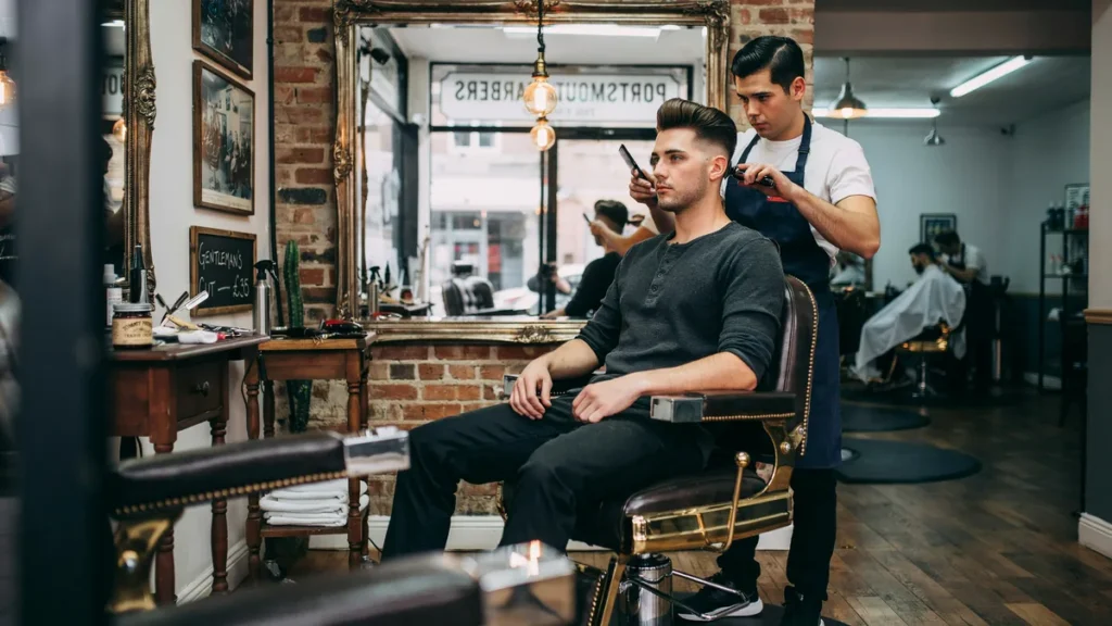 Modern pompadour hairstyle with clean volume in a professional Southsea barbershop