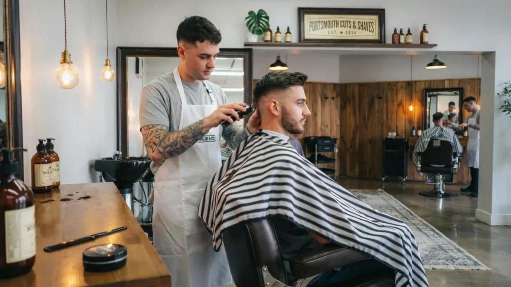 Clean skin fade haircut with textured top in a modern Portsmouth barbershop